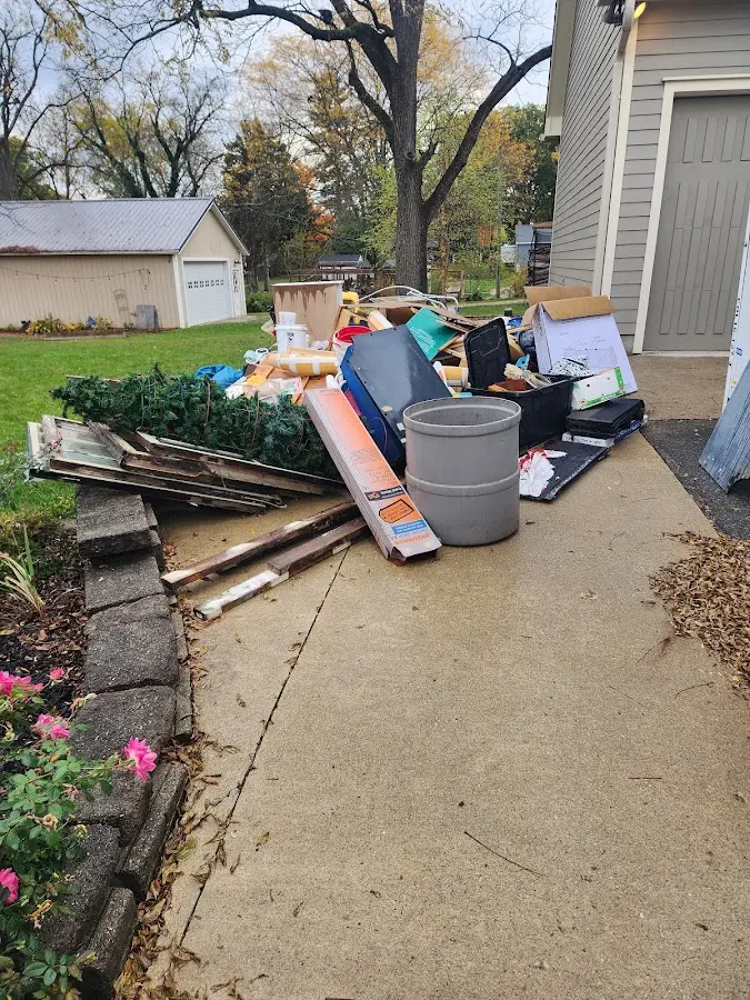 Dumpster being loaded with debris for Demolition Dumpster Rental in Ravenna